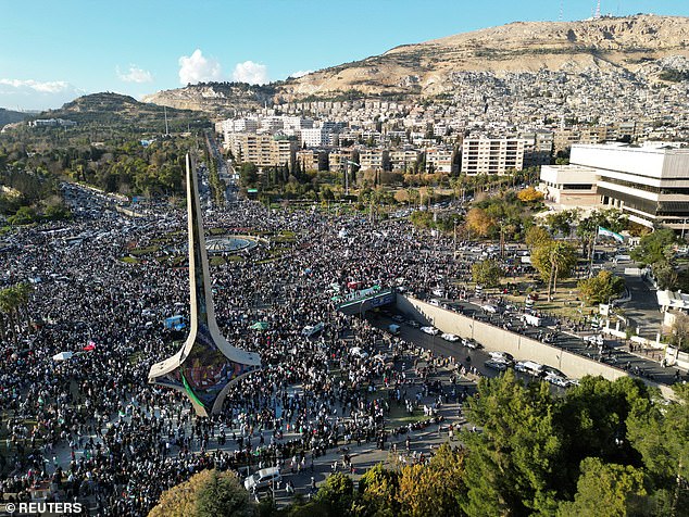 A drone view shows Damascus city, after fighters of the ruling Syrian body ousted Syria's Bashar al-Assad, Syria