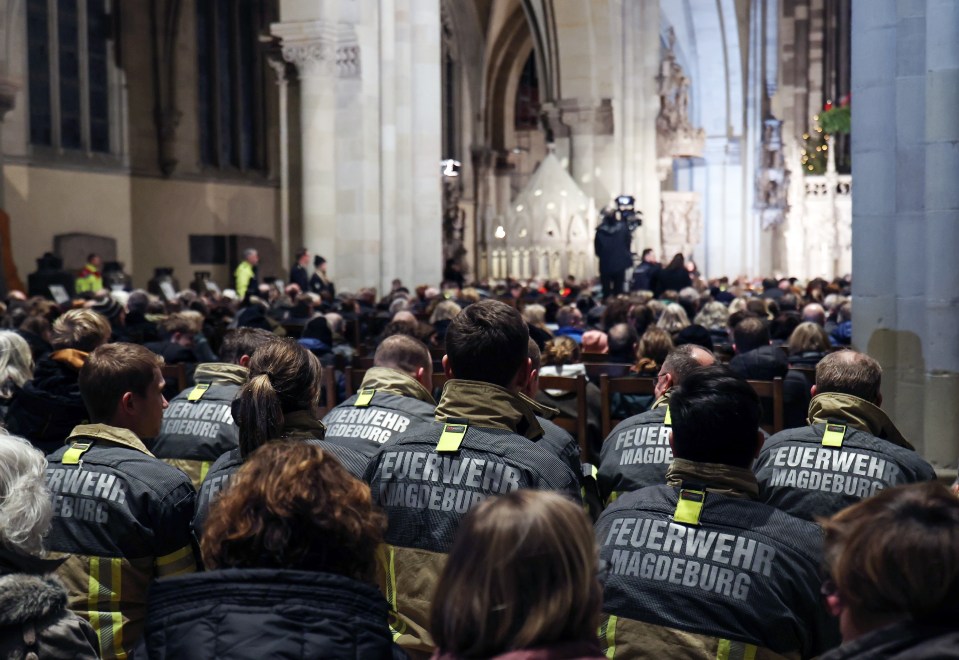 Firefighters attending memorial service in the cathedral yesterday