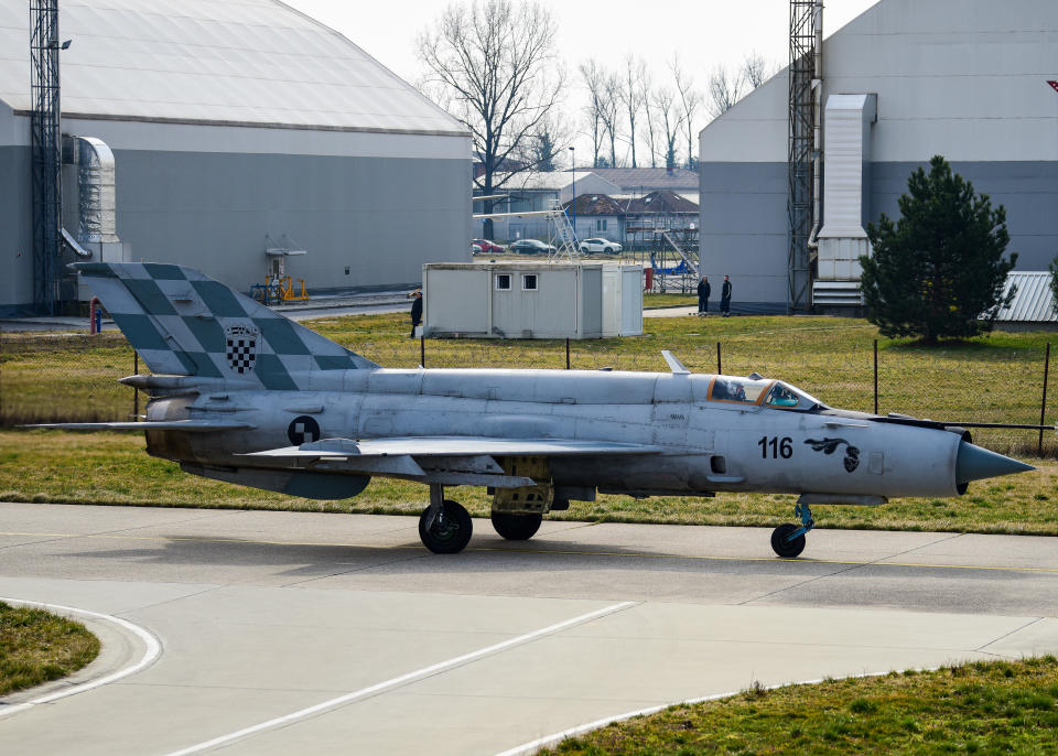 A Croatian MiG-21 pilot assigned to the 191st Fighter Squadron taxis out to the flight line during Agile Combat Employment operations with the 31st Fighter Wing, Aviano Air Base, Italy at Croatia’s 91st Air Base at Pleso, March 17, 2022. Missions such as these enhance the readiness necessary to respond to any potential challenge in Southeast Europe. (U.S. Air Force photo by Tech. Sgt. Miquel Jordan)