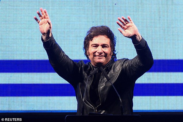 Argentine President Javier Milei gestures onstage during a rally to launch his party