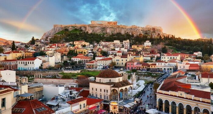 Athens, Greece - Monastiraki Square and ancient Acropolis with rainbow