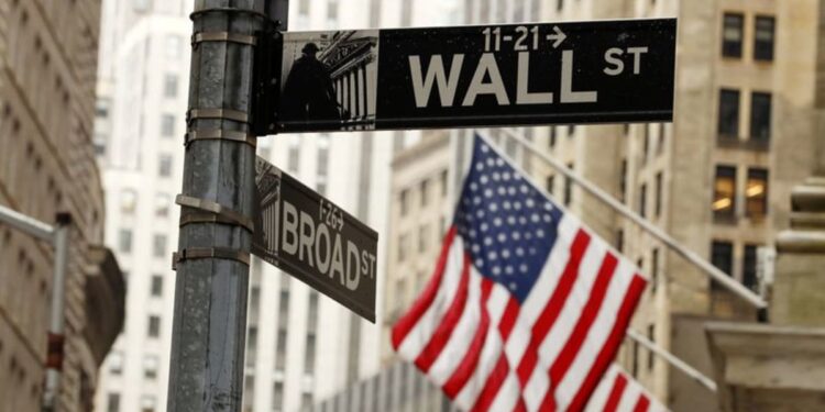 Wall Street tumbles as Fed projects slower rate cuts next year