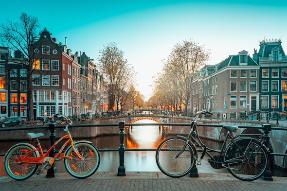 Amsterdam, buildings and canals at sunset