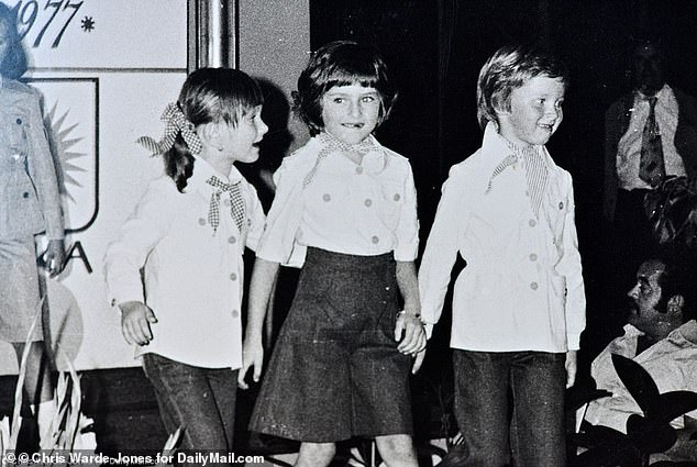 At just five years old, Melania was recruited to model in the the catalogues of the clothing manufacturer that employed her mother. She's seen modeling the clothes as a child (center)