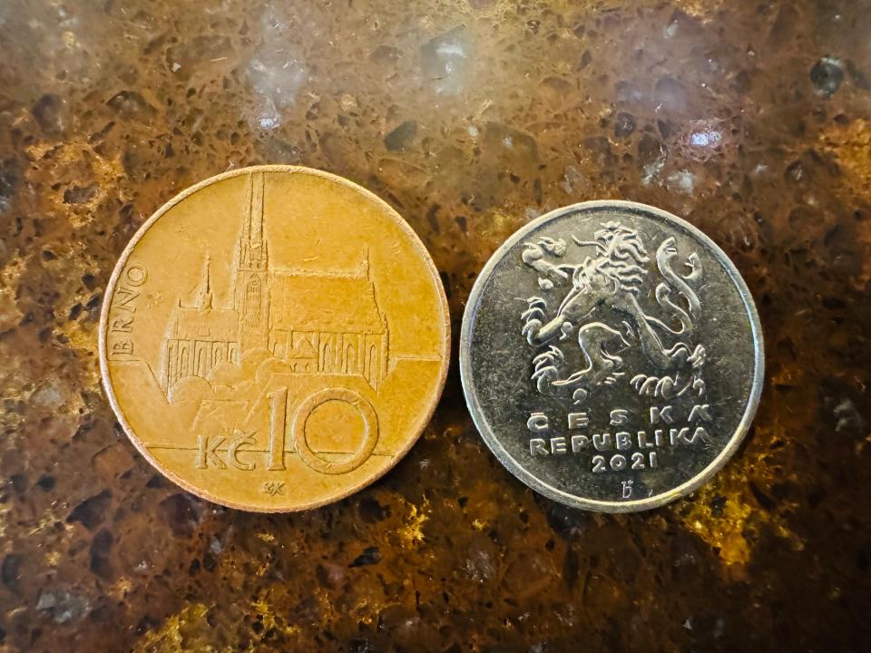 Two Czech koruna coins on a table.