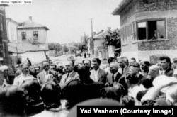 Dimitar Peshev (center left with moustache) speaks with residents of Kyustendil amid mass deportation fears.