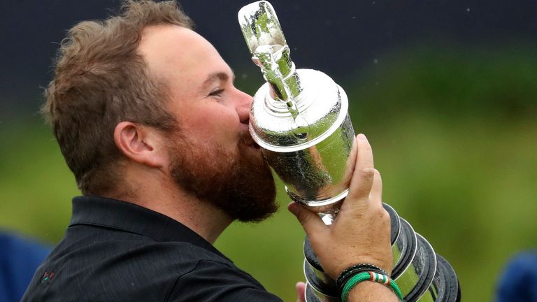 Ireland's Shane Lowry holds and kisses the Claret Jug trophy after winning the British Open Golf Championships at Royal Portrush in Northern Ireland, Sunday, July 21, 2019.(AP Photo/Peter Morrison)