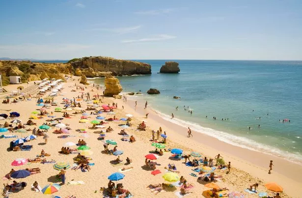 Tourists on Praia de San Raphael in Portugal