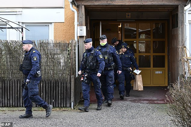 Police pictured outside the apartment where the shooting of Momika took place. Sweden, which once boasted Europe's lowest crime rate , is facing a crime epidemic, writes Sue Reid