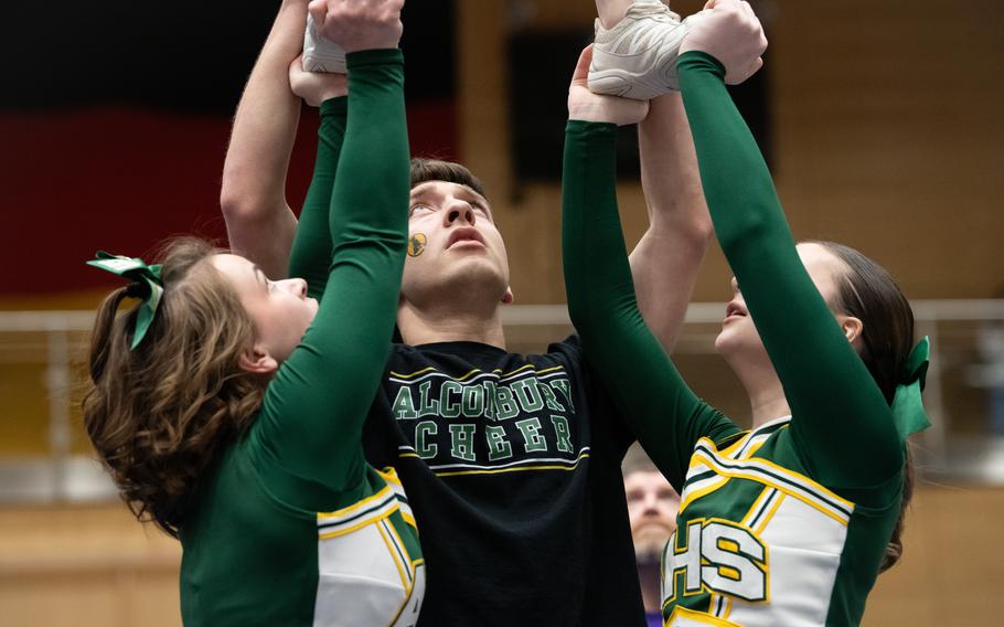 Gabriel Rodriguez keeps a teammate aloft.