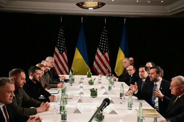 Delegations from the U.S. and Ukraine meeting at a long table.