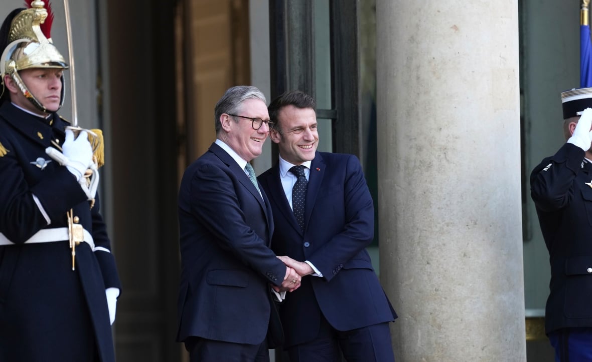 French President Emmanuel Macron, right, greets Britain's Prime Minister Keir Starmer as he arrives for an informal meeting of leaders from key European Union nations and the United Kingdom at the Elysee Palace in Paris on Monday.