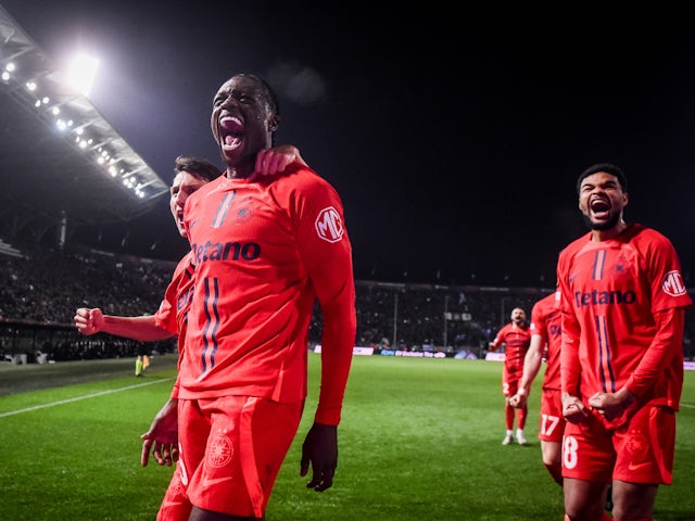 FCSB players celebrate Joyskim Dawa's goal on February 13, 2025