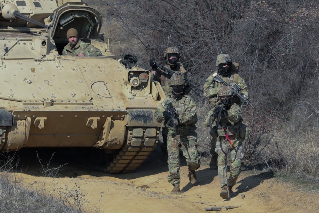 U.S. Soldiers with 4th Battalion, 6th Infantry Regiment, 3rd Armored Brigade Combat Team, 1st Armored Division, approach a building with simulated adversaries during an urban assault course at Novo Selo Training Area, Bulgaria, Feb. 11, 2025. 1st...