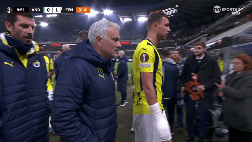 Post-game scene showing a soccer coach and player.