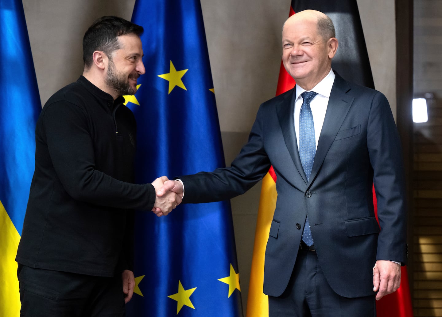 Germany's Chancellor Olaf Scholz (right) and Ukraine's President Volodymyr Zelensky meet for talks at the Munich Security Conference on Feb. 15.