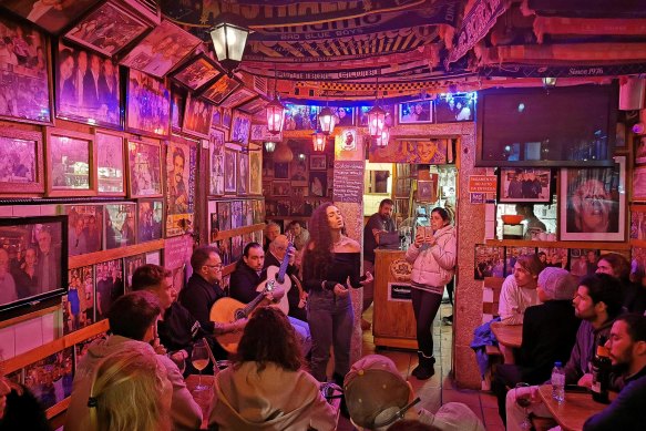 A fado singer performs in a popular dark and cosy bar in the Bairro Alto neighbourhood, central Lisbon.
